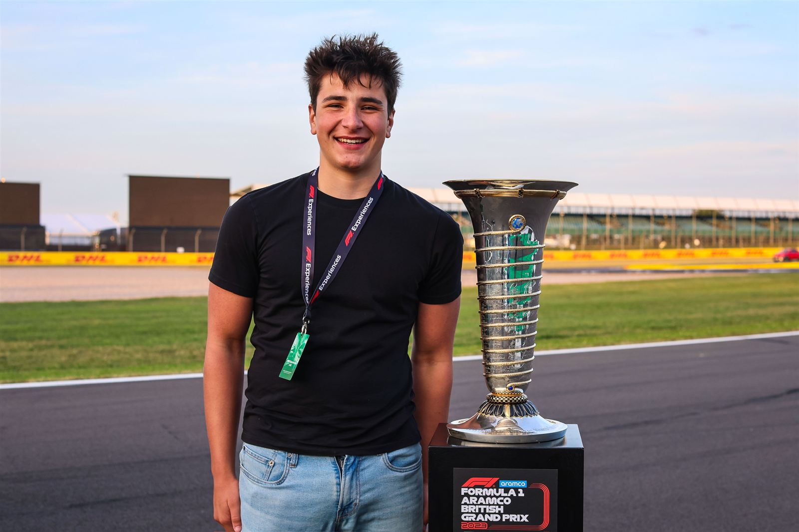 Ben with the British Grand Prix trophy on the Silverstone start-finish straight